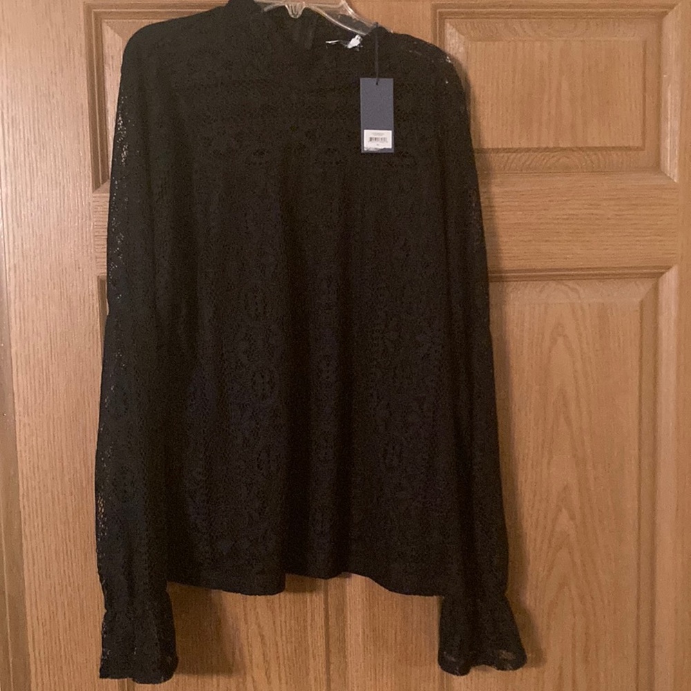 New with tags. Black lace front and sleeves.